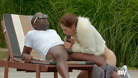 Slutty brunette milf and a hot red hussy riding a cock