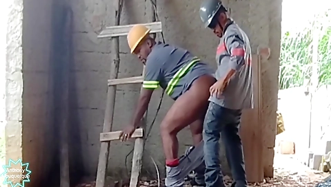 Ebony and black man in a black suit with a white hairpin